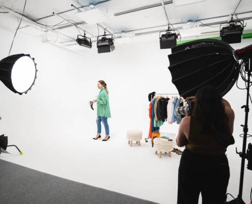 Fashion Shoot at REV Studio Woman on set in colorful clothing in photo studio