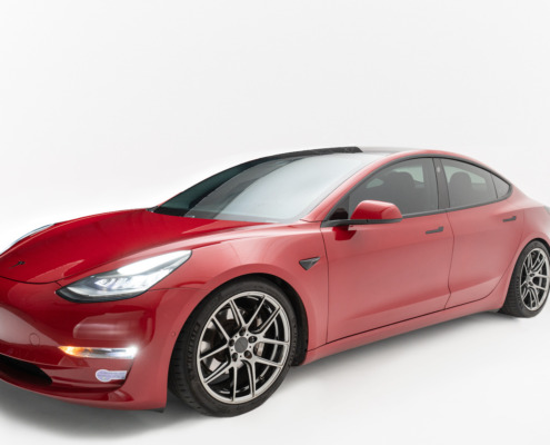 Car Photo Shoot at REV Studio Red Tesla photographed on white cyc wall