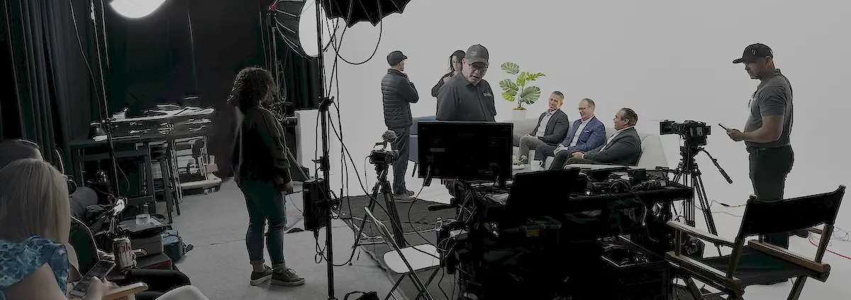 REV Studios team collaborating with a client on a branded video production project